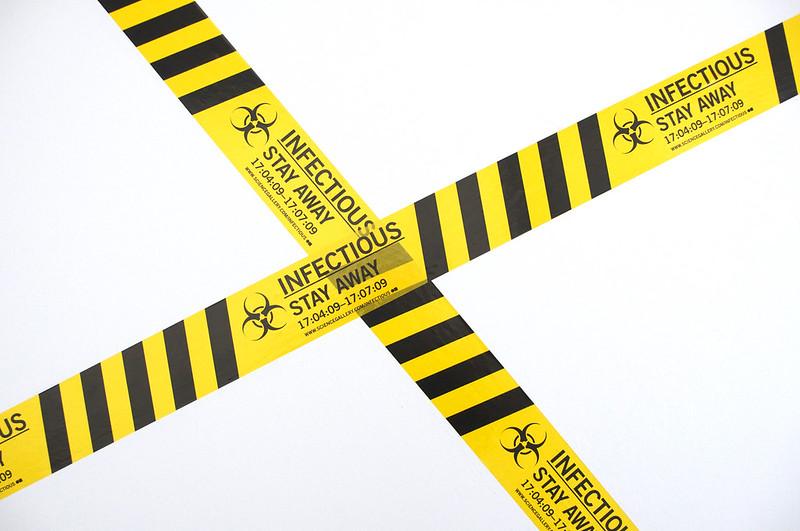 Caution tape with infectious symbol