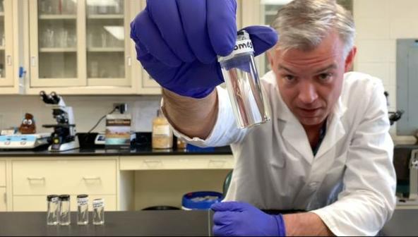Dr. Martin Nielsen holding a sample